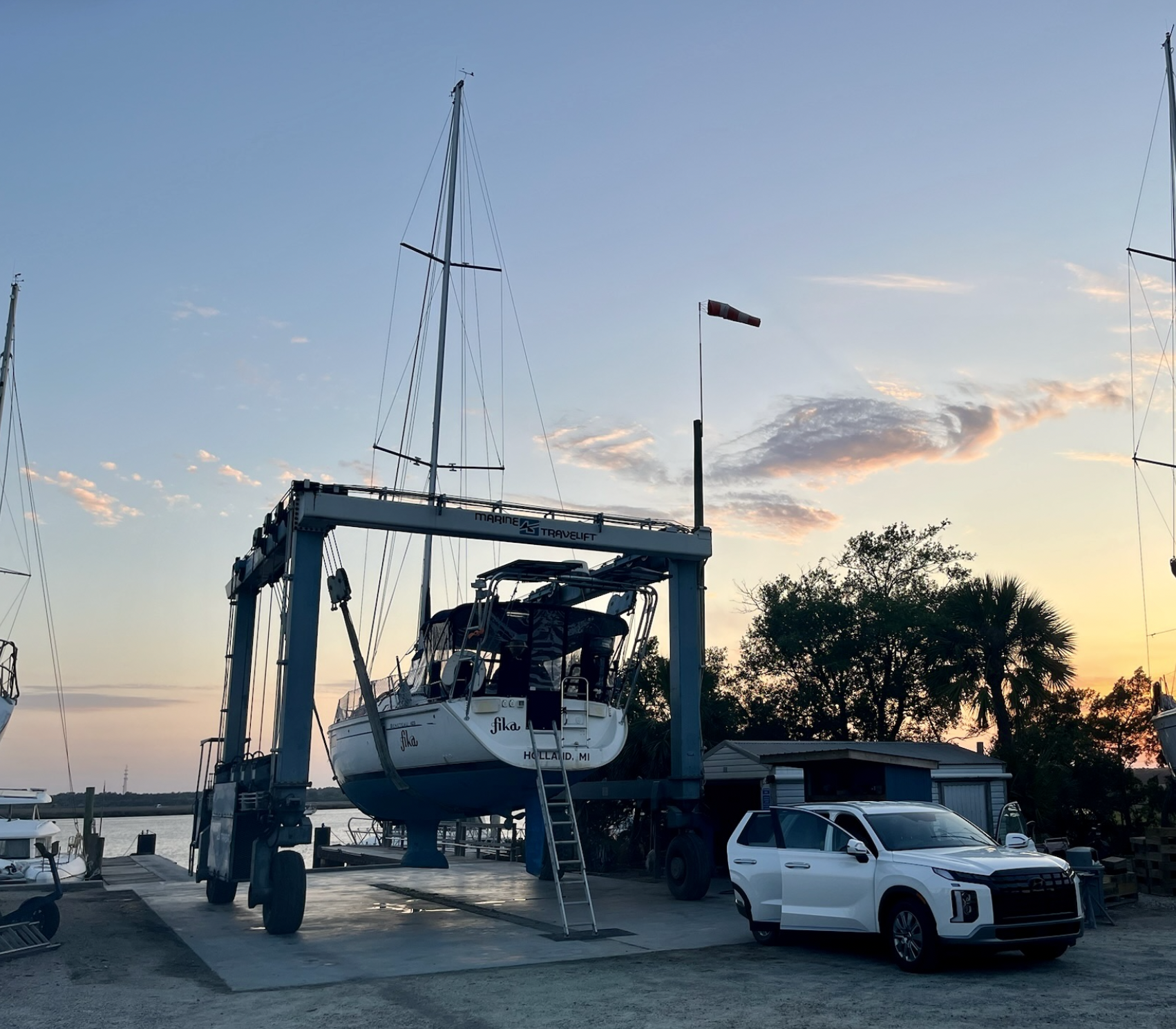 SV Fika hauled out of the water in Georgia, with the rental car loaded up for the road trip back to Michigan — Bob came with us